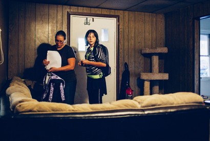 Arwen waits patiently while her mom checks to make sure she's got all of her homework finished before heading out the door to the bus stop. Joseph Terranova for Bread for the World.