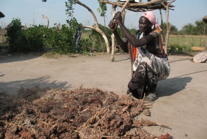 Dabora Nyibol, a returned refugee in South Sudan, prepares sorghum, a staple in her country. Photo by Stephen H. Padre/Bread for the World.
