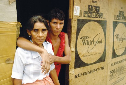 Family living in a box house. Bread for the World. 