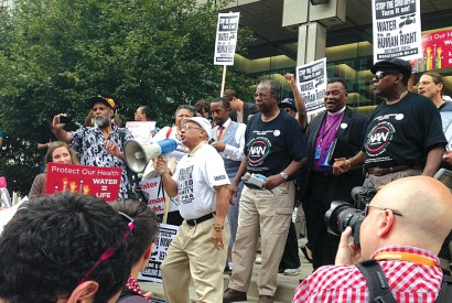 Detroit residents protesting in 2014 after the municipal government shut off water to 30,000 residential units. Photo courtesy of the Unitarian Universalist Service Committee.