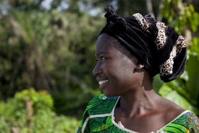 Martha Togdbba of Kpaytno, Liberia, irrigates her small farm with water from a nearby stream that she walks back and forth to with a watering can. Laura Elizabeth Pohl/Bread for the World.