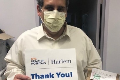 An environmental services manager at Harlem Hospital Center thanks Charitable Alumni of FAMU and Tuskegee and the Wesley Foundation for meals