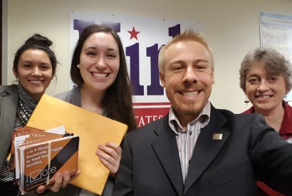 Zach Schmidt, center, with Bread for the World members dropping off postcards at the campaigns. Zach Schmidt/Bread for the World.