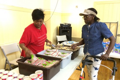 Susan La-Rose, right, visits the food pantry at Lt. Joseph P. Kennedy Community Center in Harlem. Margaret Tran/Bread for the World.
