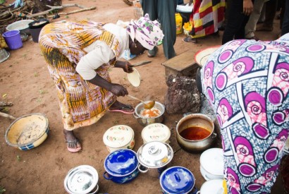 Women prepare a highly nutritious meal from the orange-fleshed sweet potato, a vitamin A-rich crop introduced in Northern Ghana. / USAID/Ghana