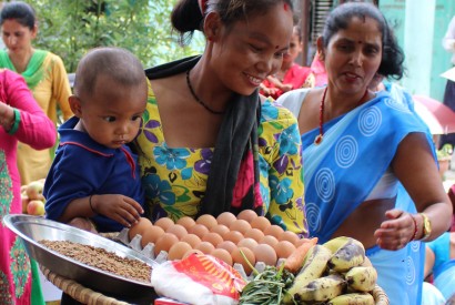 A mother in Nepal receives nutritious foods and soap to improve the nutrition of her children. Photo: : Kesi Marcano-Collier / Bread for the World