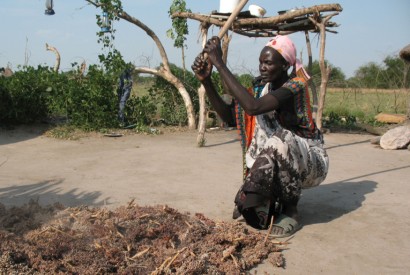 Dabora Nyibol, a returned refugee in South Sudan, prepares sorghum, a staple in her country. Photo by Stephen H. Padre/Bread for the World