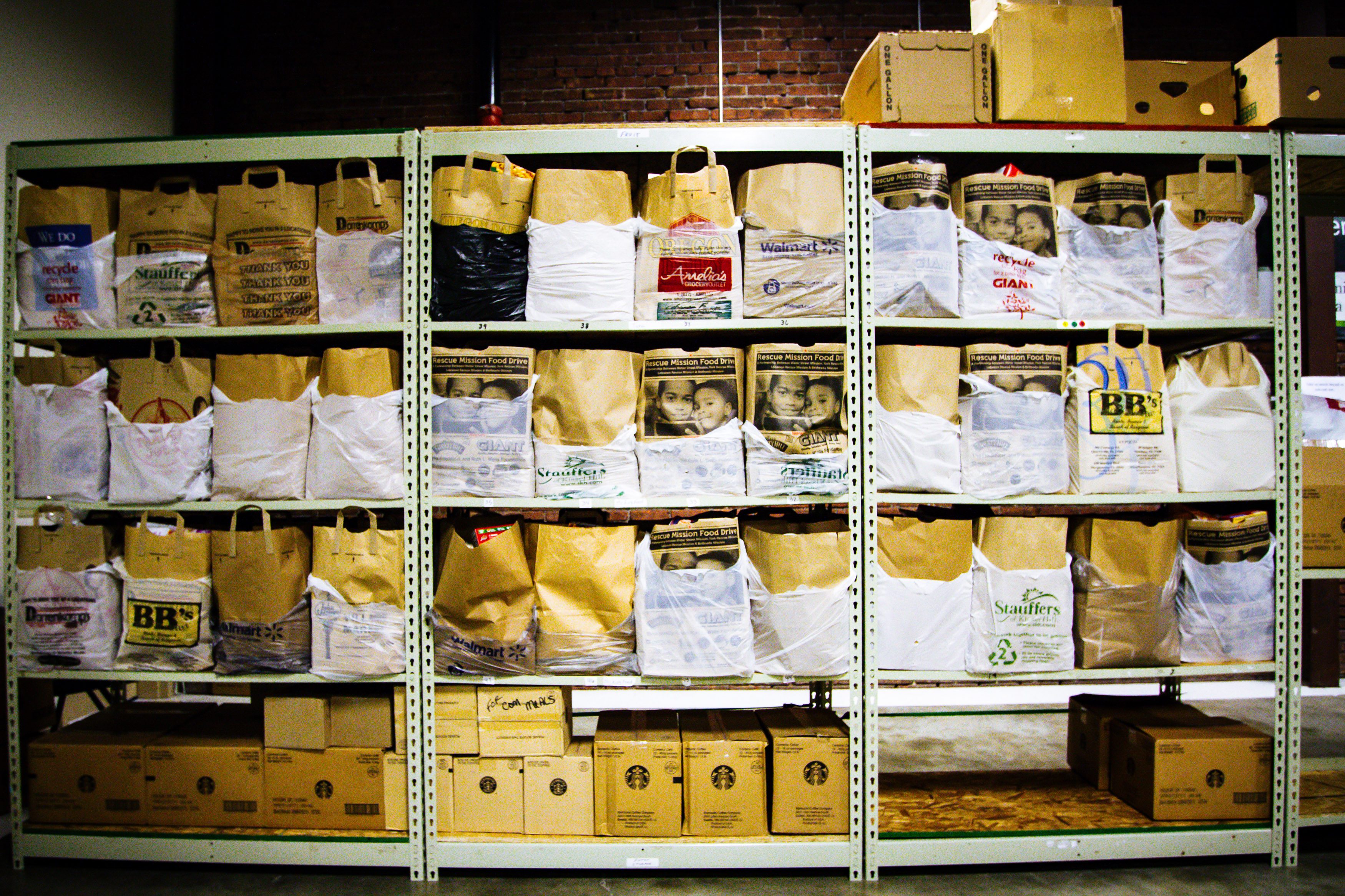Bags of nonperishable food items line the warehouse shelves of the Lancaster County Council of Church’s food pantry also known as the “Food Hub.” Joseph Terranova for Bread for the World.