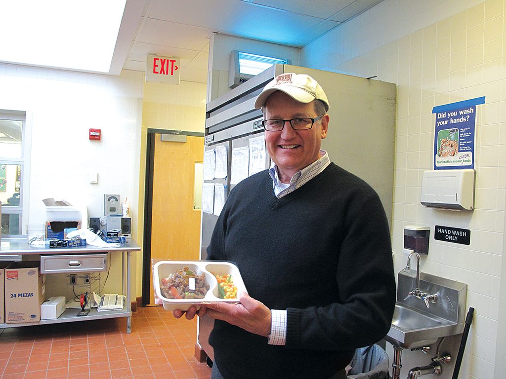 David Waters, CEO of Community Servings, displays one of the medically tailored meals prepared and delivered by the organization to chronically ill clients. Todd Post/Bread for the World.