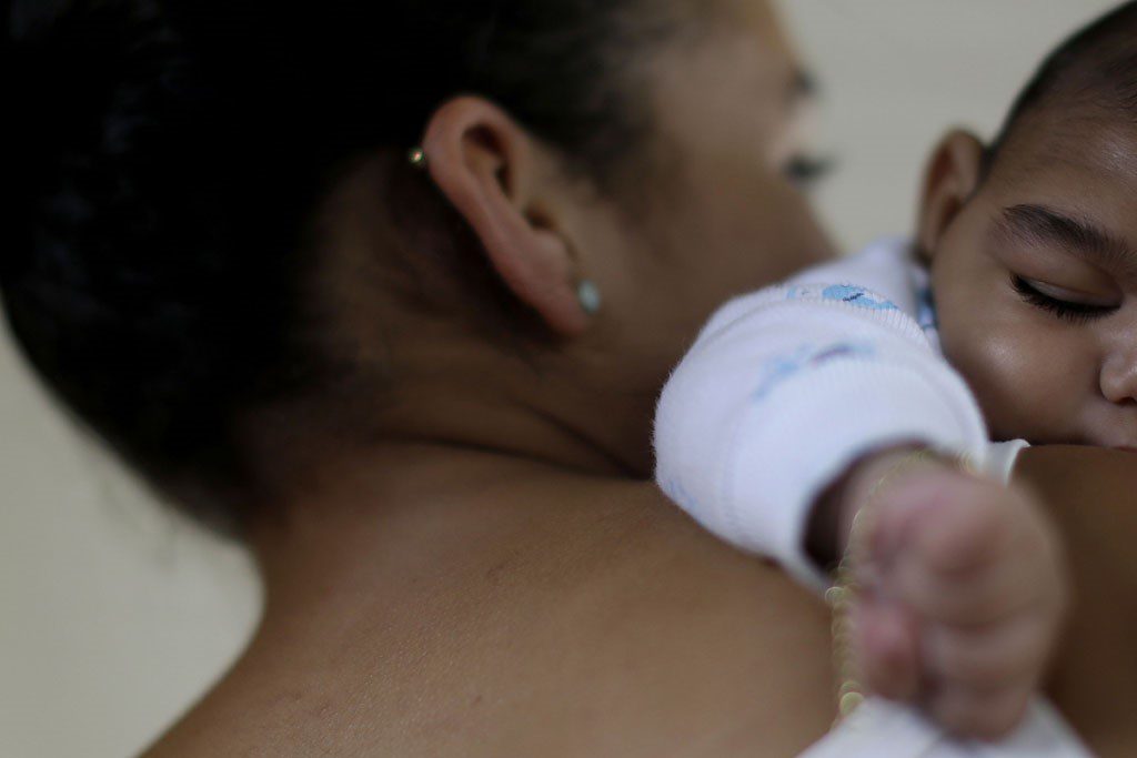 A 15-year-old in Recife, Brazil, holds her a four-month old baby born with microcephaly. Photo courtesy of UNICEF/Ueslei Marcelino.