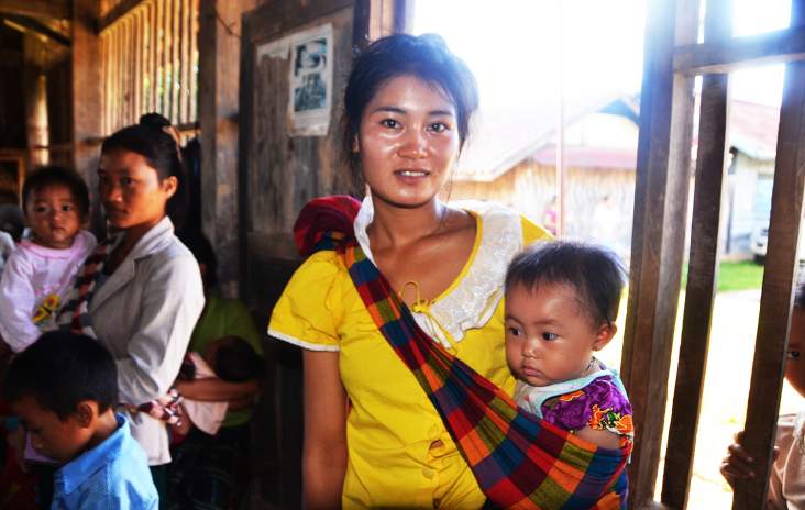 Eighteen-year-old Lin and her baby receive nutrition commodities such as iron folic acid through an outreach program funded by USAID and UNICEF in Laos. Barry Bracken,/UNICEF.