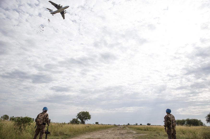 UN peace keepers provide security as the World Food Program drops food in Bentiu, South Sudan in 2015. Photo courtesy of the World Food Programme.