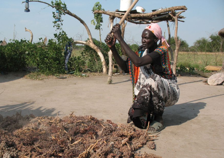 Dabora Nyibol, a returned refugee in South Sudan, prepares sorghum, a staple in her country. Photo by Stephen H. Padre/Bread for the World