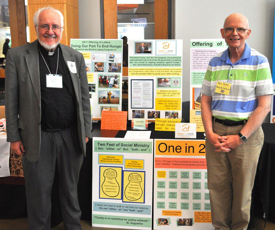 Rev. Russel Melby, left, and Stephen Panther, right, at the Southeastern Iowa Synod Assembly (ELCA) in Des Moines, Iowa.