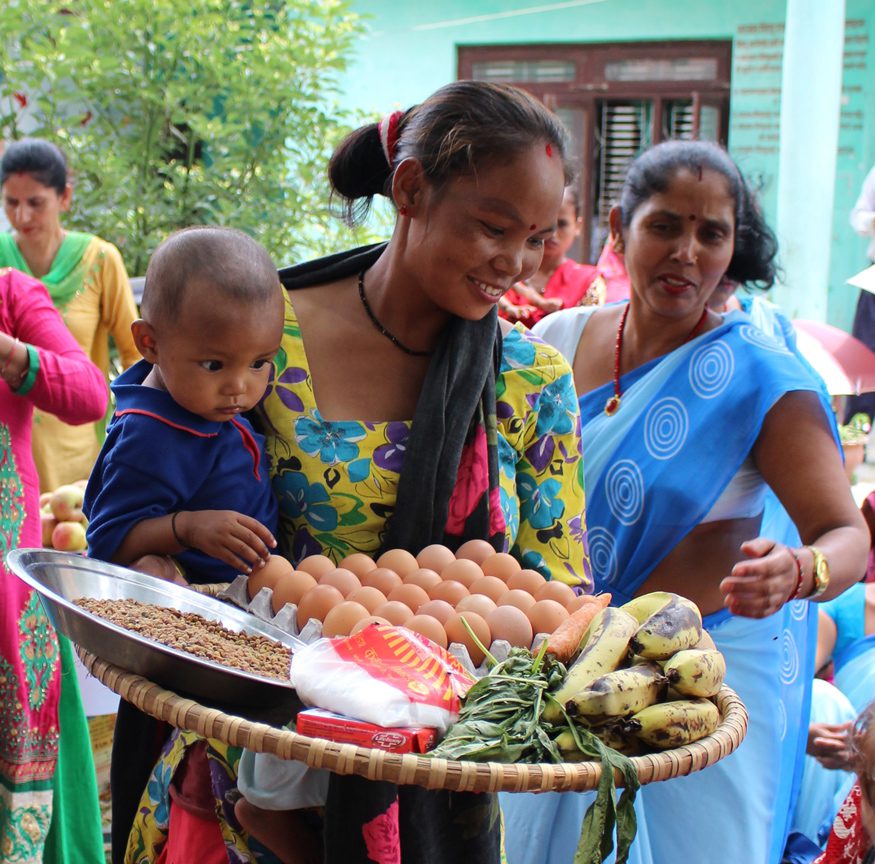 A mother in Nepal receives nutritious foods and soap to improve the nutrition of her children. Photo: : Kesi Marcano-Collier / Bread for the World