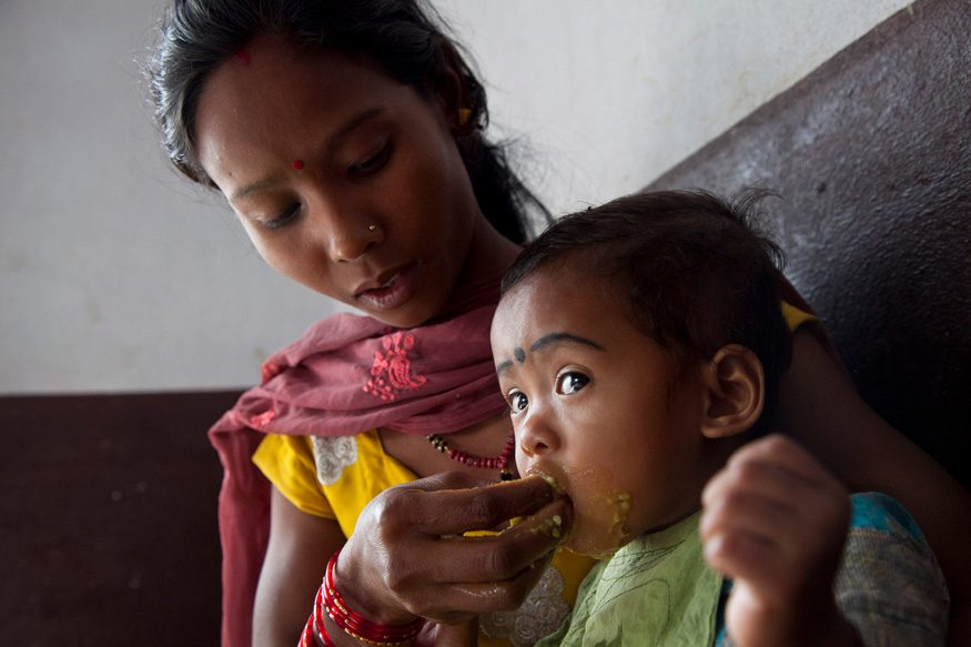 Sharmila Chaudhari feeds her daughter Sanjana, 19 months, at the Nutrition Rehabilitation Home in Dhangadhi, Nepal. Photo: Laura Pohl / Bread for the World