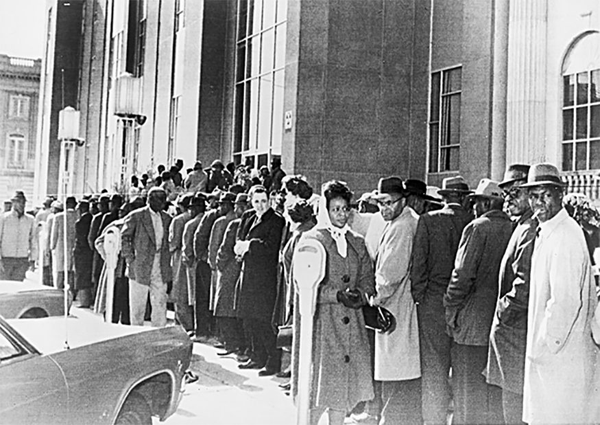 African Americans, waiting to register to vote, form a long line outside the Dallas Courthouse in Selma, Alabama, February 1965. New York World-Telegram and the Sun Newspaper Collection, Prints and Photographs Division, Library of Congress.