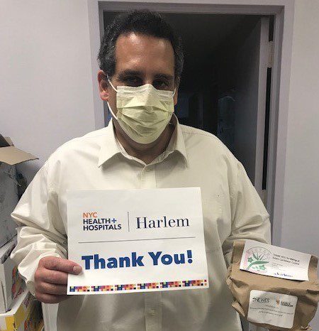 An environmental services manager at Harlem Hospital Center thanks Charitable Alumni of FAMU and Tuskegee and the Wesley Foundation for meals