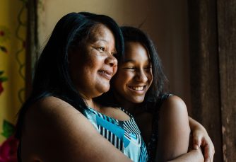 two ladies smiling