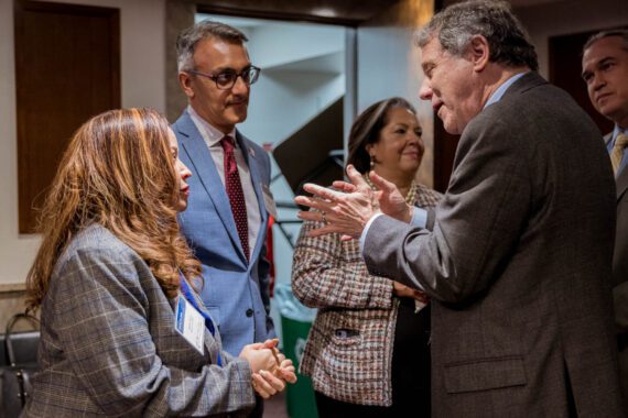 Bread Managing Director Min. Heather Brown speaks with Sen. Sherrod Brown (D-OH) during the "Keeping the Faith" reception.